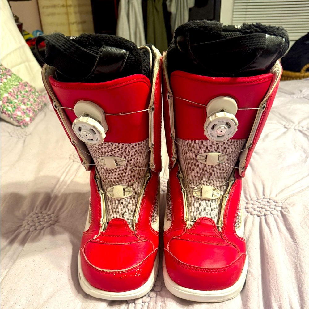 Vans wmn red snowboard boots sz 7. Comfortable. Minor scuffs.
